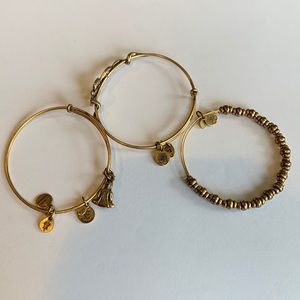 Alex and Ani 3 gold bracelets.